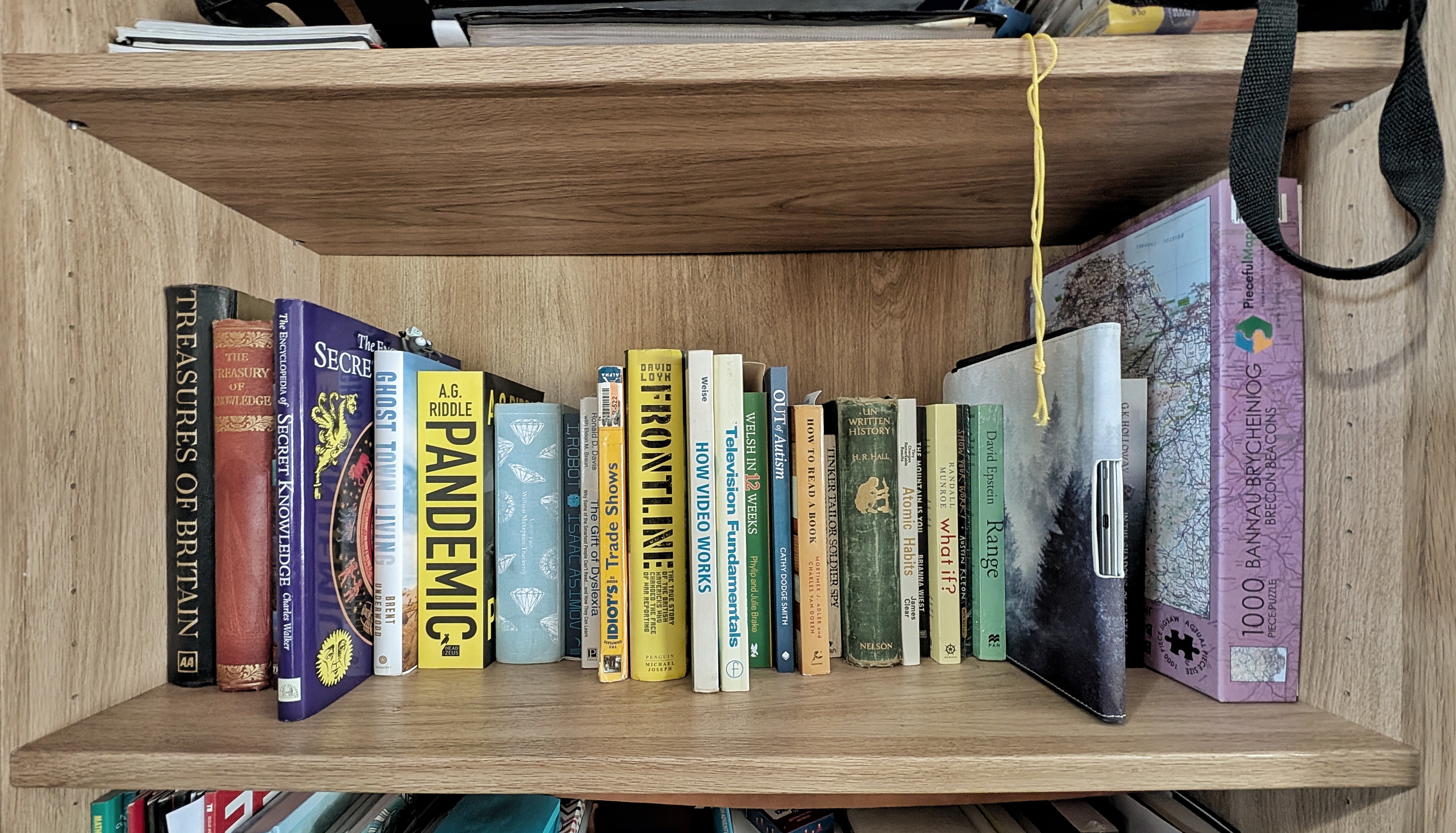 A candid, well-lit shot of my office shelves/unfinished projects to anchor the visual narrative
