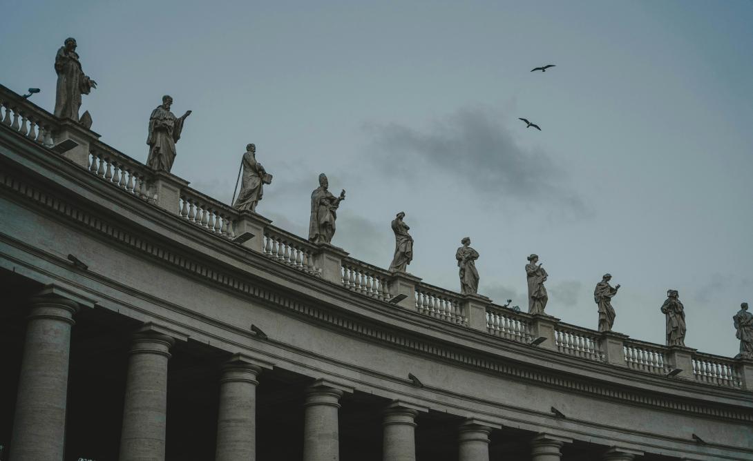 Marika Iaccarino's https://unsplash.com/photos/a-group-of-statues-on-top-of-a-building-2b3WxSaJylc